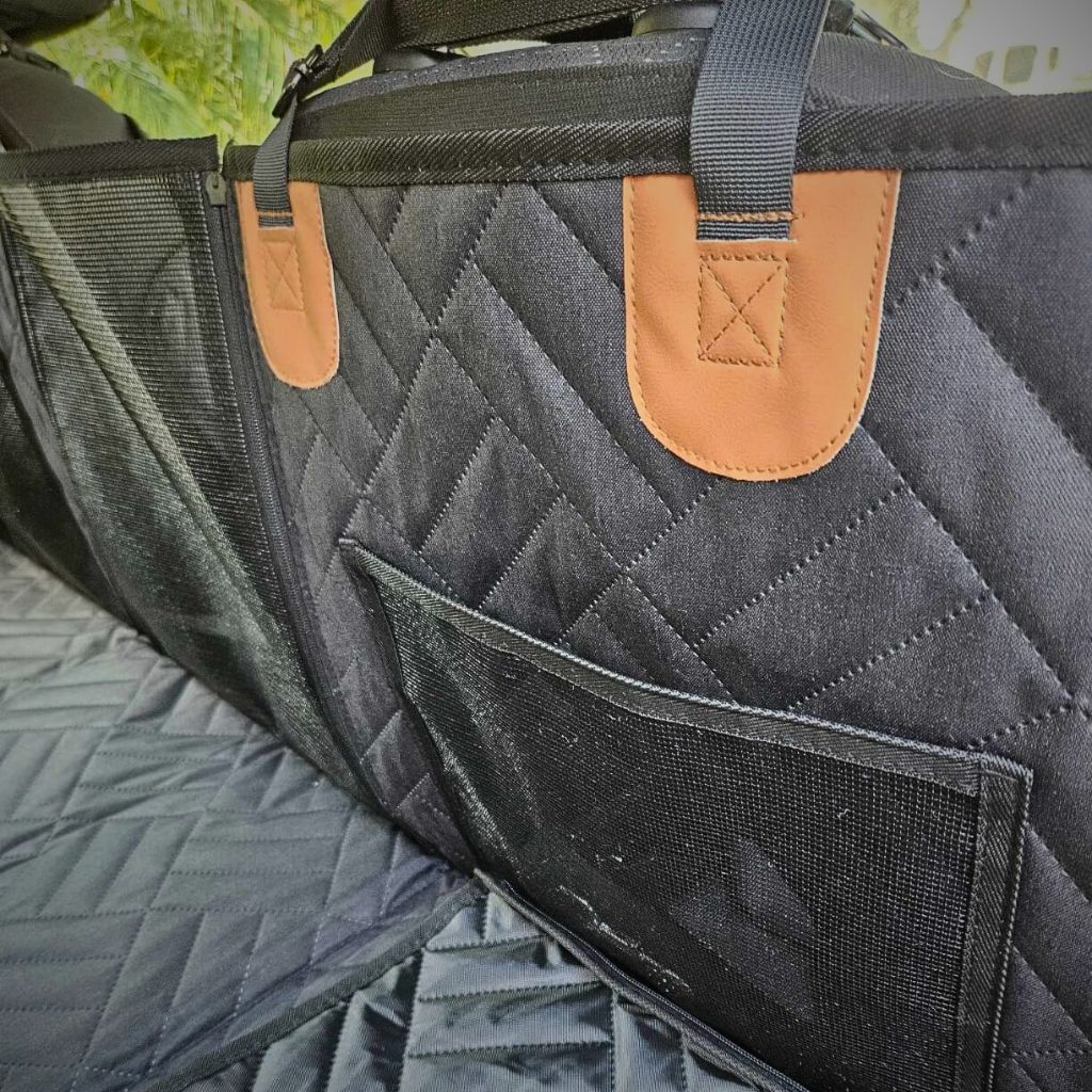 Close-up view of the Pawsely Pup-tastic Car Backseat Cover & Extender, highlighting the quilted design and sturdy attachment straps.